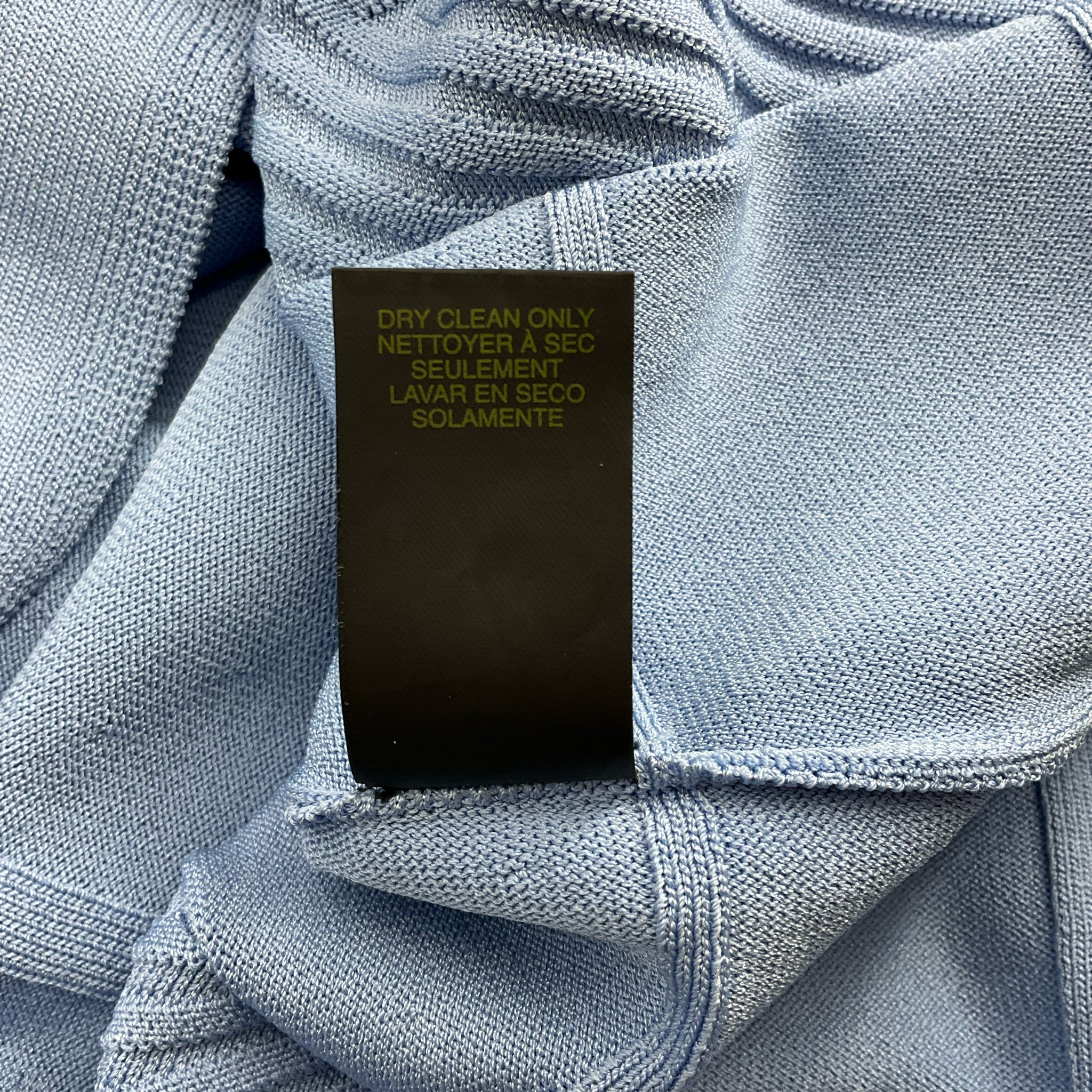 Care label of Cynthia Steffe Blue Textured Dress - Size Large indicating dry clean only instructions for proper garment maintenance.