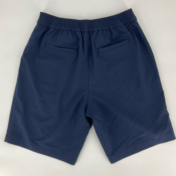 Back view of Tommy Bahama navy chino shorts for women, size large, featuring elastic waistband and dual welt pockets for comfort and style.