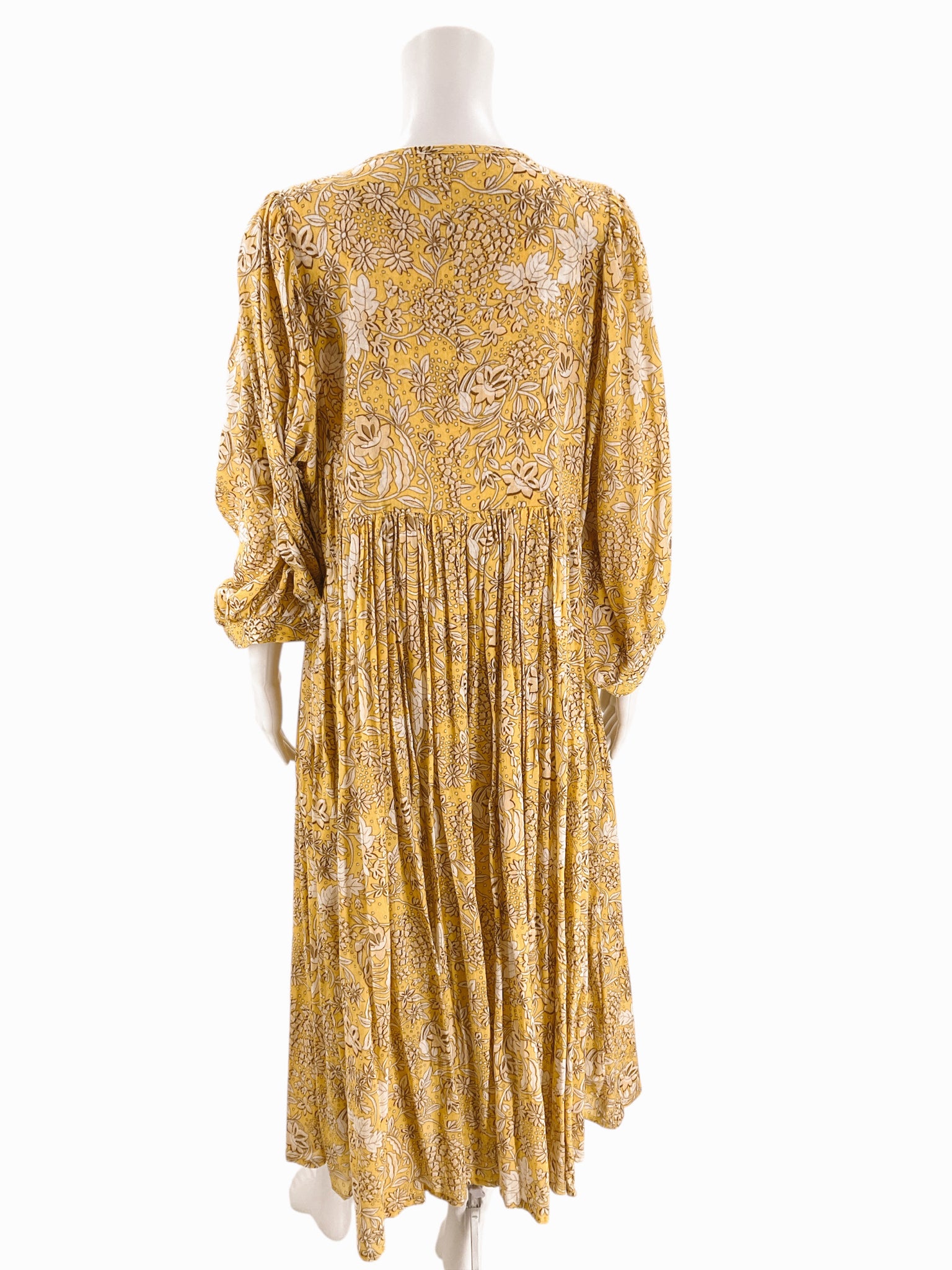 Back view of Sundry Yellow/Tan Floral Dress - Size 4 showing flowy silhouette and gathered waist, perfect for relaxed beachwear fashion.