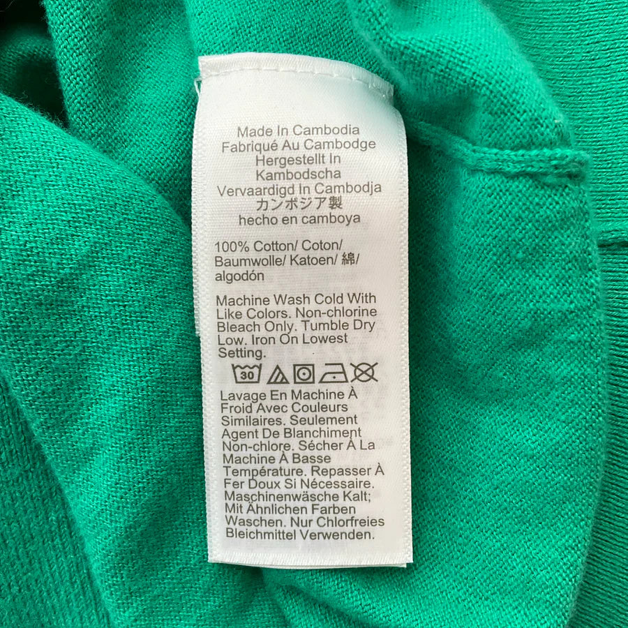 J Crew green solid pre-owned ladies top in size medium, featuring a classic design and soft fabric.