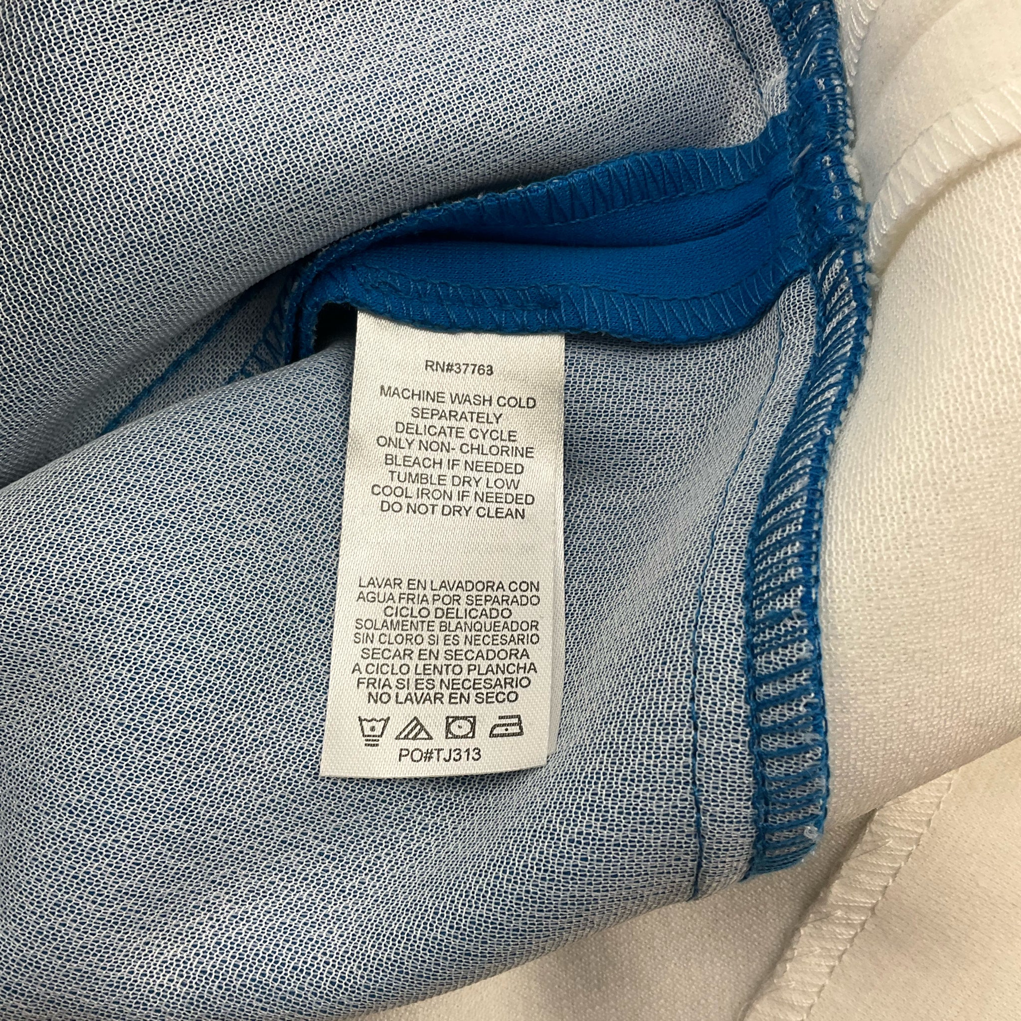 Laundry Dress Size 6 care label showing machine wash instructions and fabric care symbols for sustainable fashion shoppers.