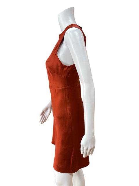 Side view of Banana Republic Sleeveless Mini Dress Size 6P in rust silk, highlighting the sleek silhouette and sleeveless cut.