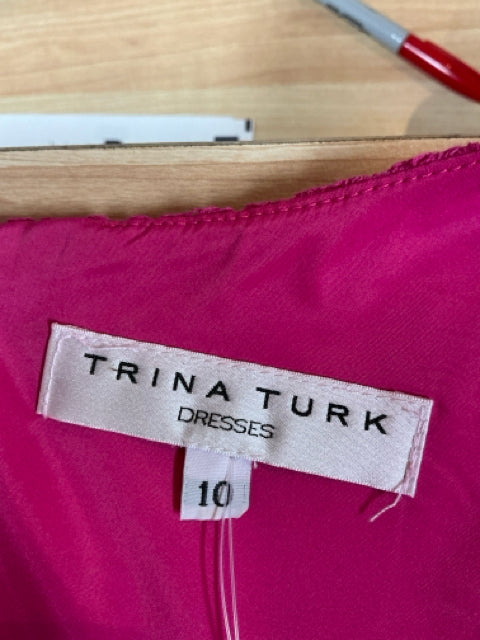 Trina Turk brand label with size 10 tag inside the Pink Textured Pre-Owned Ladies Dress, confirming designer authenticity and sizing.
