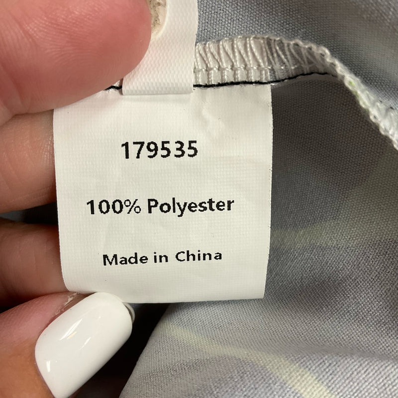 Fabric label showing Uoozee dress is made of 100% polyester and manufactured in China. Durable and easy-care material.