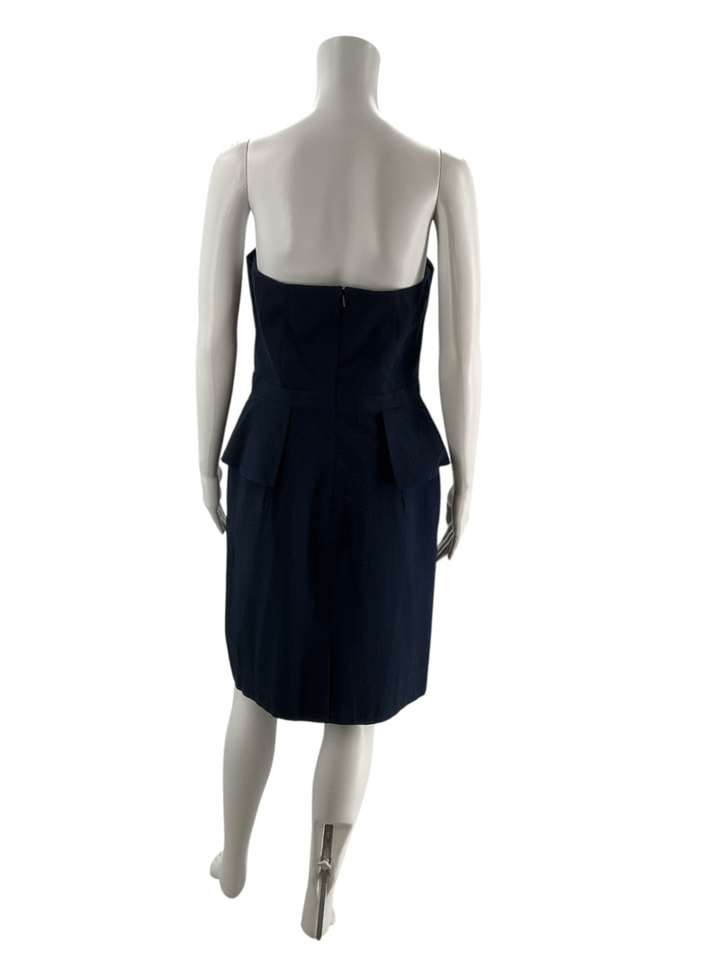 Back view of Banana Republic navy blue strapless peplum dress, size 10, featuring zip closure and tailored silhouette for formal occasions.