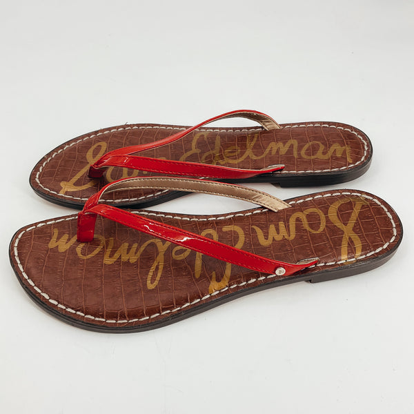 Sam Edelman red solid pre-owned ladies sandals in size 8.5 with red patent leather thong straps and croc-embossed brown footbed. Flat casual flip-flop ideal for summer.