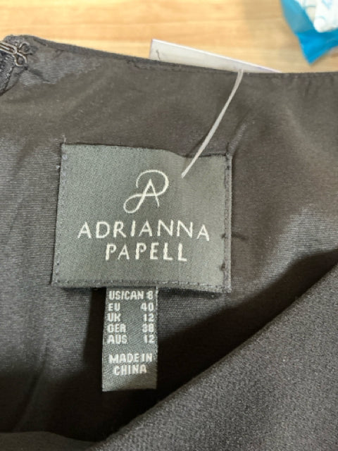 Brand label of Adrianna Papell Black/Pink Floral Dress showing size 8 US and international size conversions, made in China.