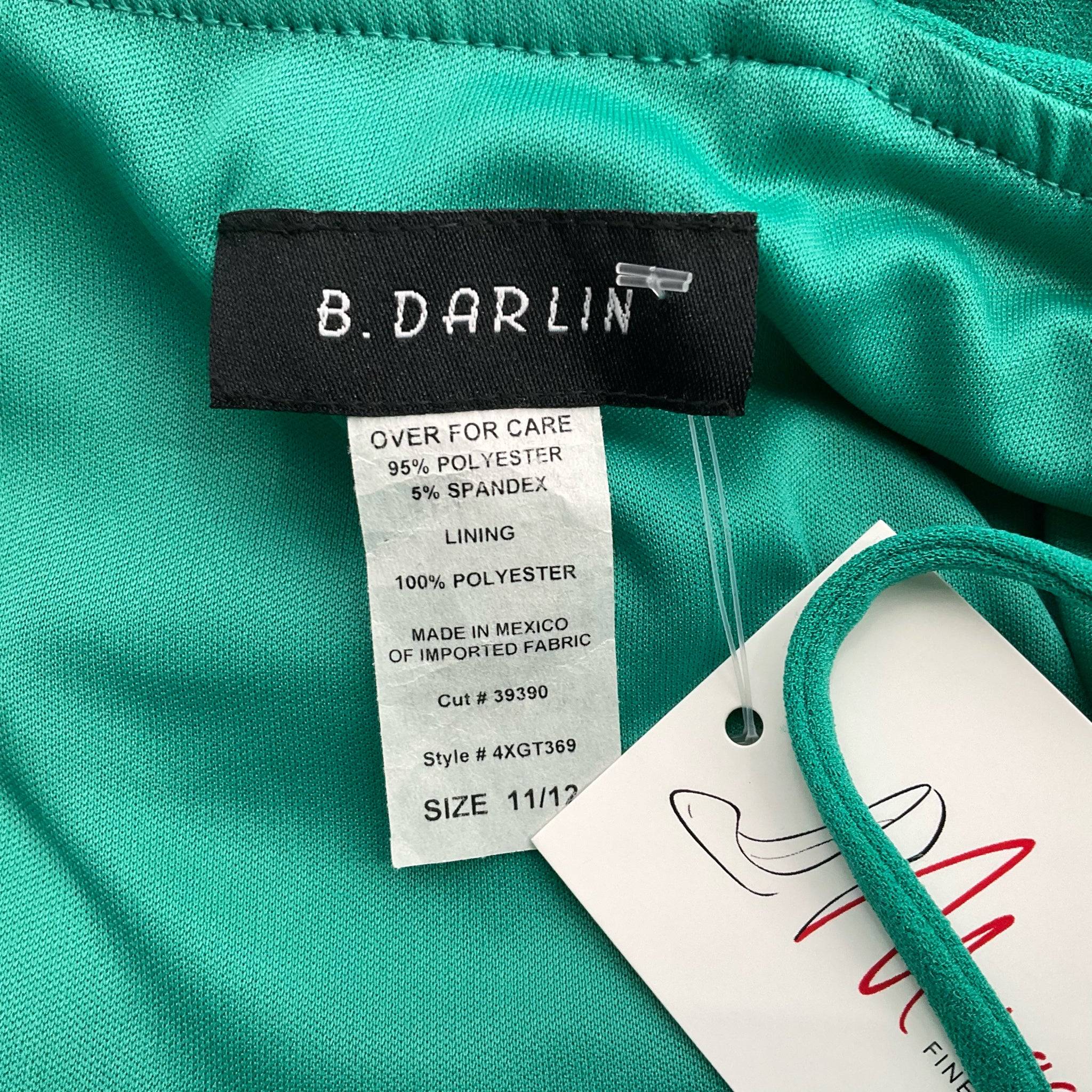 Close-up of B Darlin dress label showing size 11/12 and fabric details, available at Margaret’s Fine Consignments for stylish pre-owned fashion.