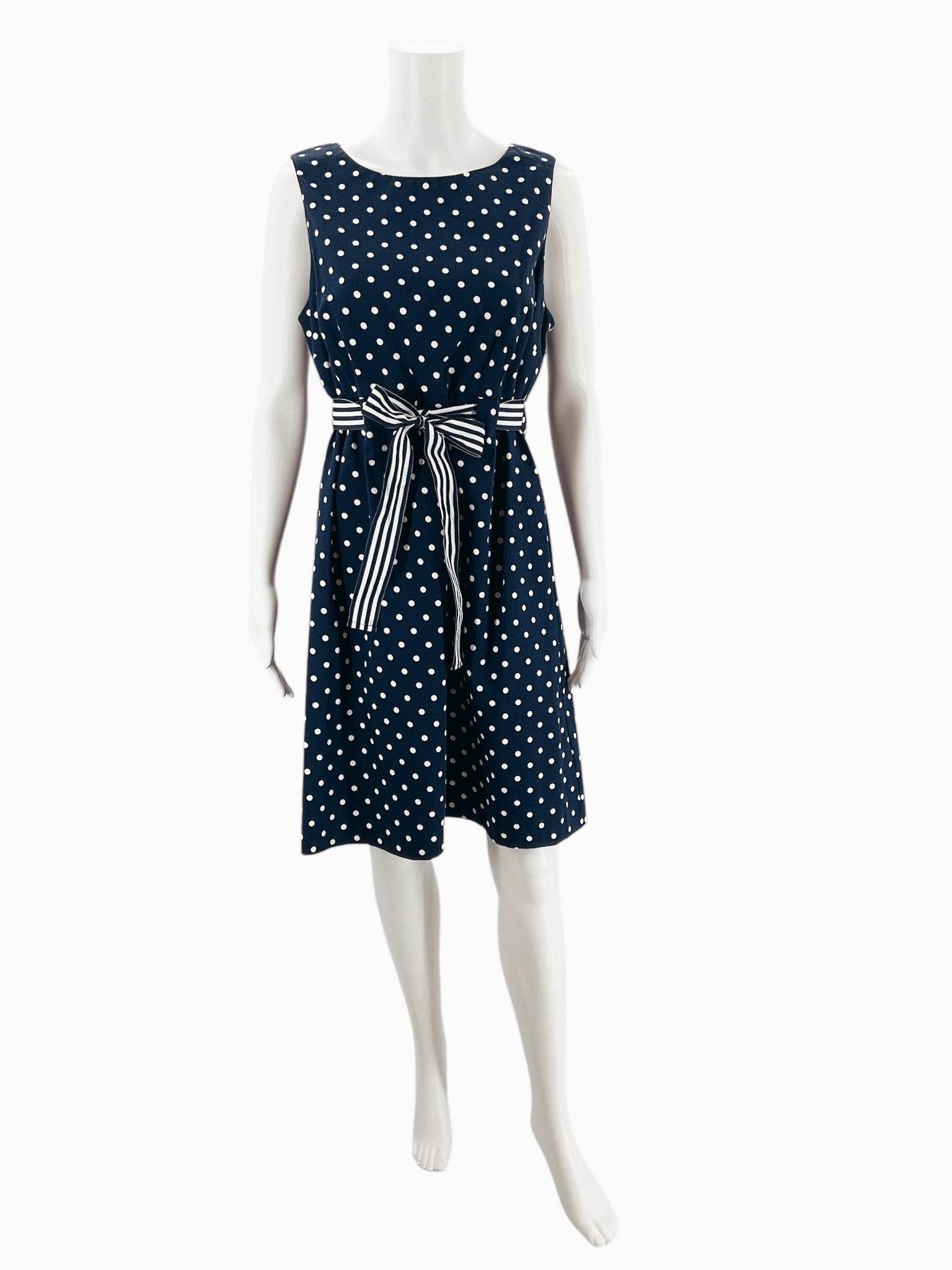 Front view of Jessica Howard sleeveless navy and white polka dot mini dress size 12 with striped waist tie, Margaret’s Fine Consignments.