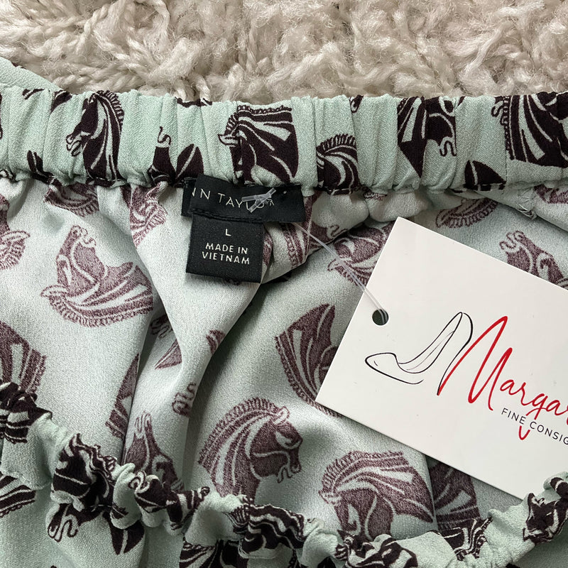 Close-up of Ann Taylor label and Margaret’s Consignment tag on Mint/Maroon Pre-Owned Top - Size Large, confirming authenticity and size.