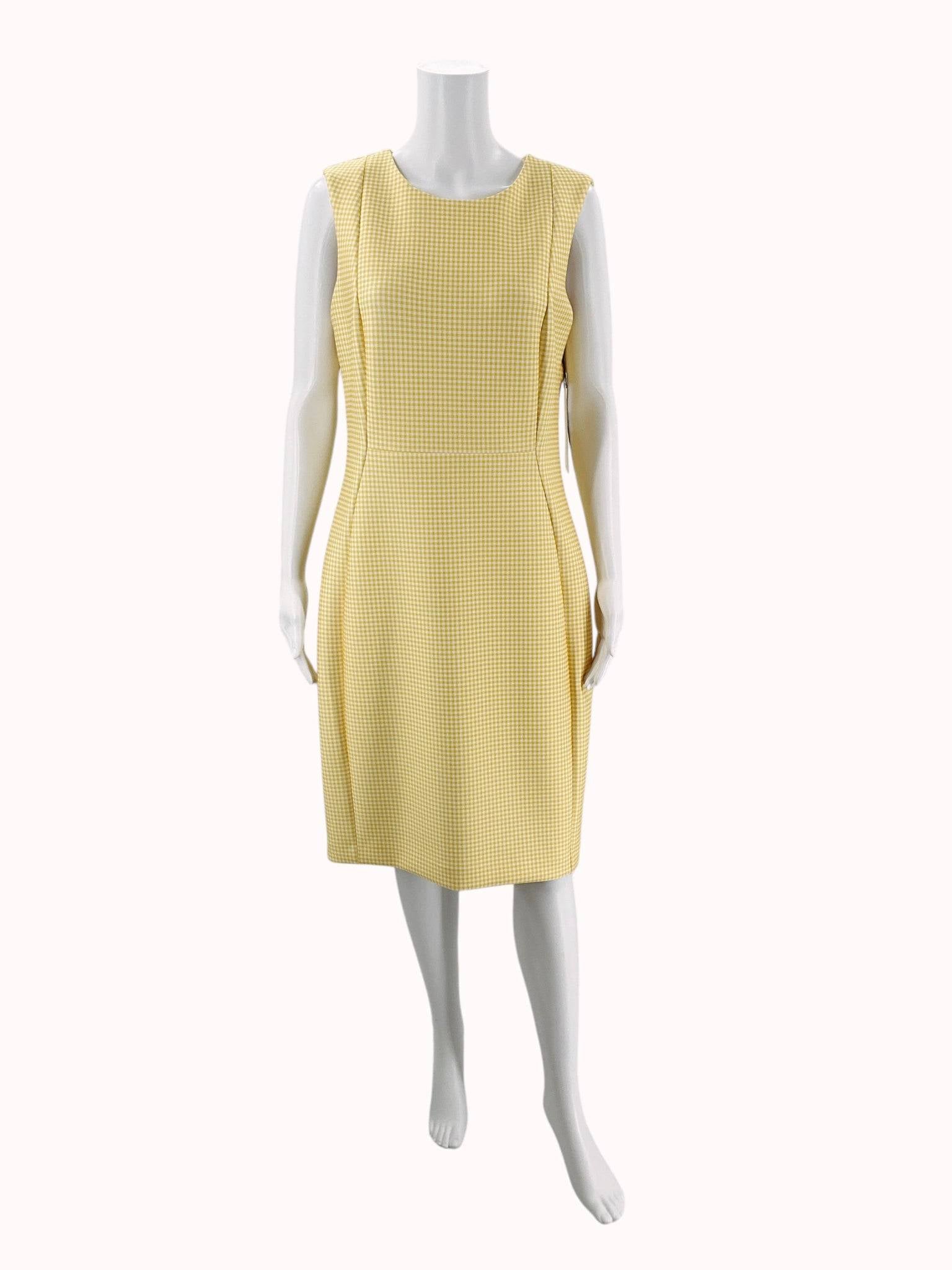 Front view of Calvin Klein yellow and white checkered mini dress, size 12, displayed on mannequin at Margaret’s Fine Consignments.