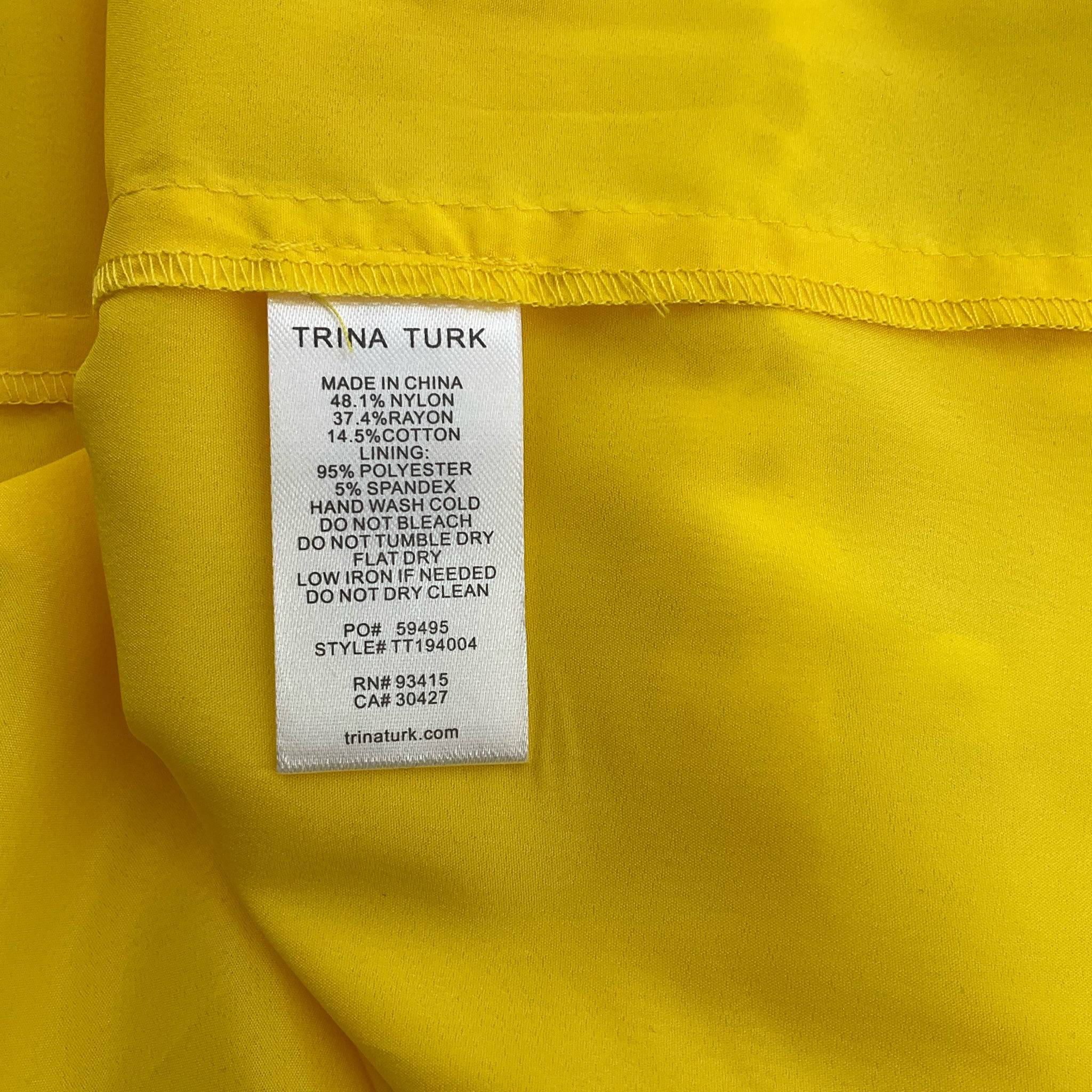Fabric care label of Trina Turk Knee Length Dress Size Small detailing material composition and washing instructions, sold at Margaret’s Fine Consignments.