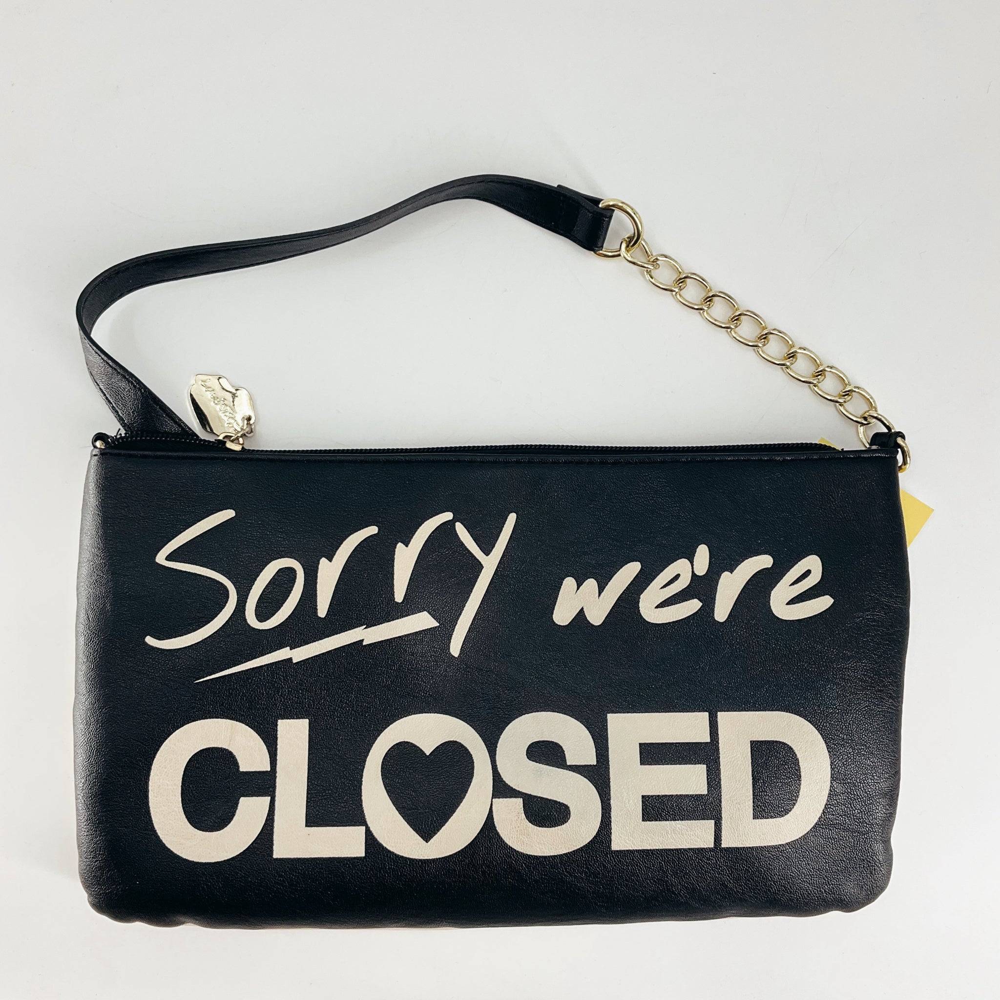 Betsey Johnson Black/White Pre-Owned Crossbody Bag featuring 'Sorry we're CLOSED' design, reversible style, gently used.