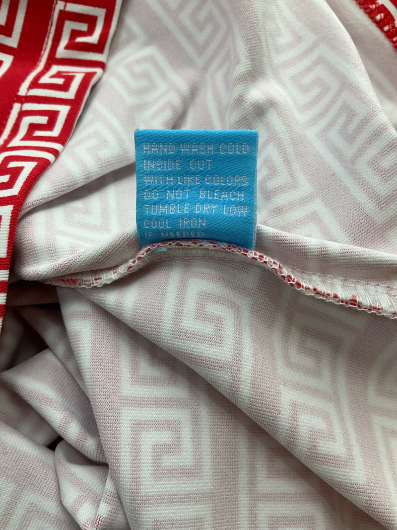 Care label for J. McLaughlin Catalina Cloth cowl neck top. Instructions include hand wash cold and tumble dry low for wrinkle-resistant wear.
