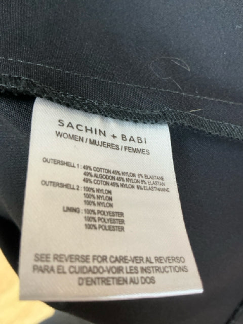 Fabric content label of Sachin & Babi Black/White Floral Pre-Owned Ladies Dress - Size 8 showing cotton, nylon, and polyester blend.