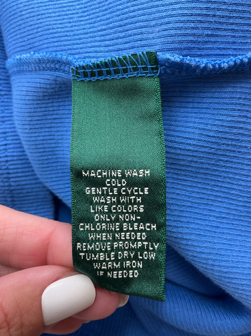 Care label on Lauren Ralph Lauren blue ribbed cotton tank top, detailing washing instructions and fabric care for size S/P.