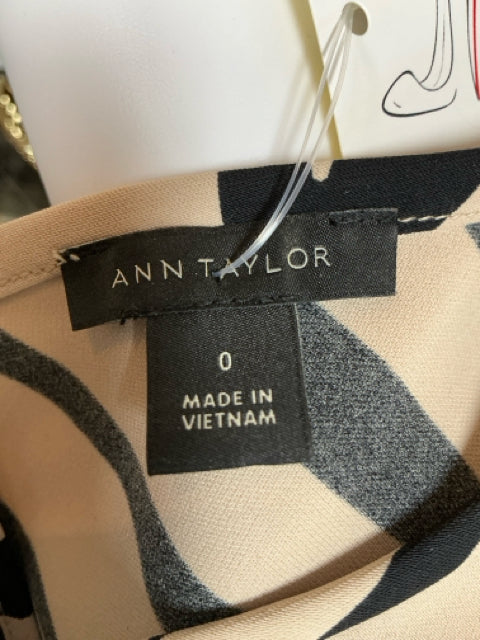 Brand and size tag of Ann Taylor dress, indicating size 0 and made in Vietnam, part of sustainable pre-owned fashion collection.