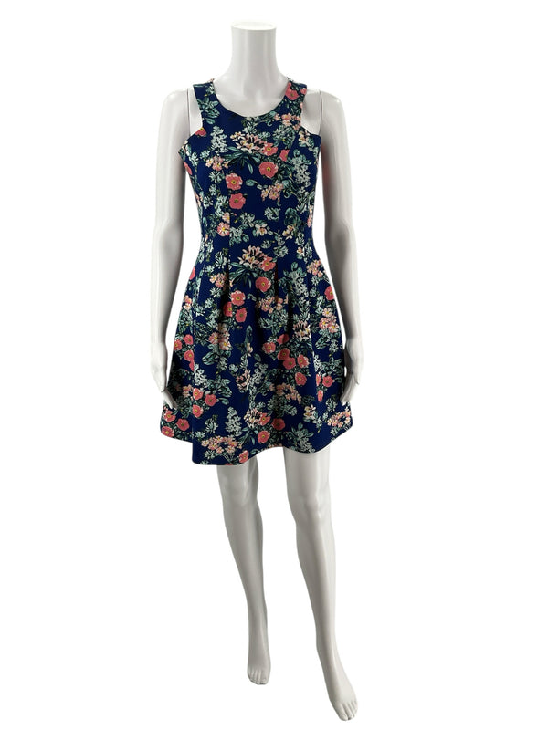 Front view of Pink Rose pre-owned sleeveless floral dress in navy with pink and green blooms, fit & flare silhouette, size medium.