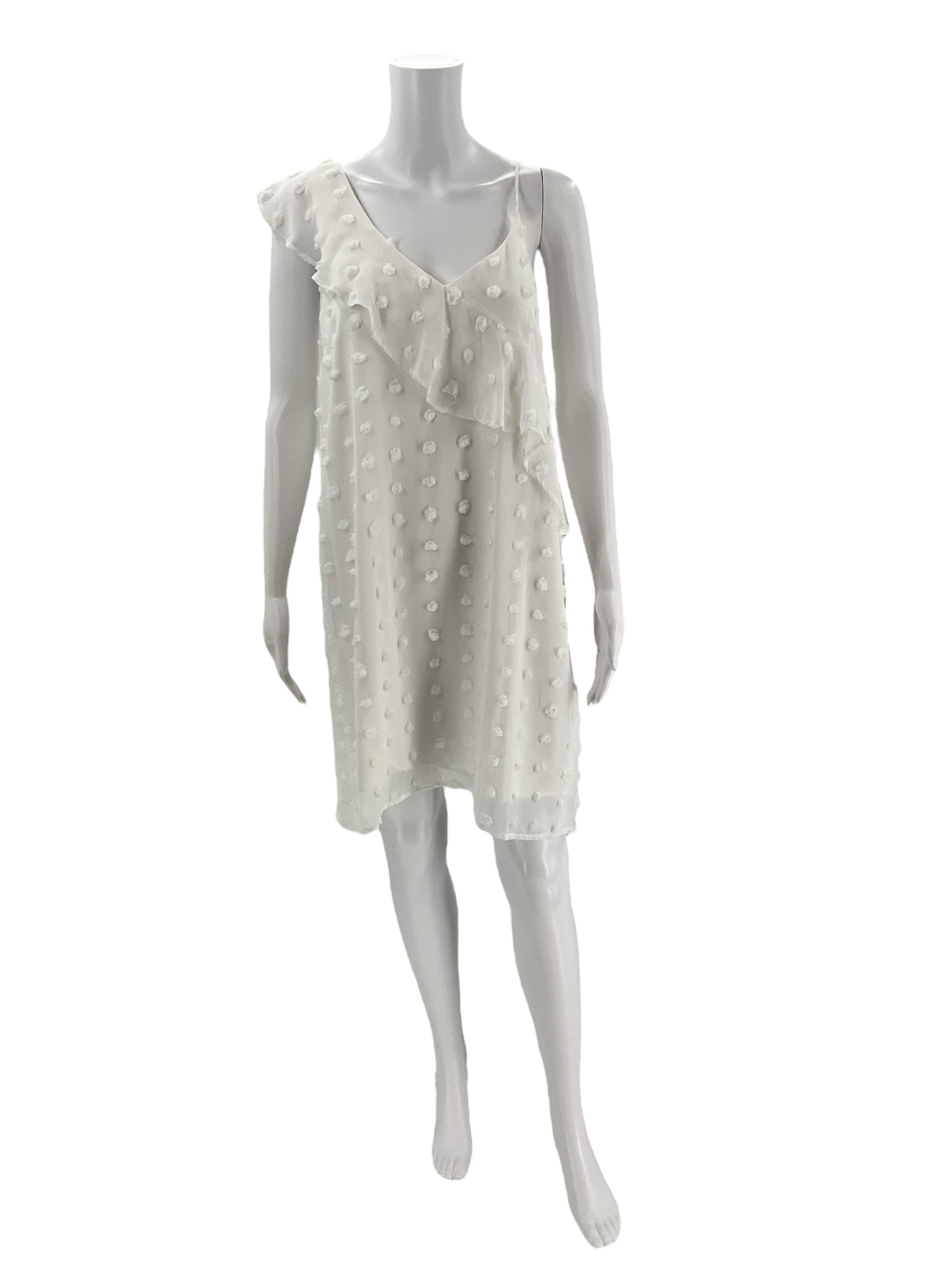 GB White Sleeveless Mini Dress Size Medium displayed on mannequin, featuring asymmetrical ruffle and dotted texture, pre-owned and gently used.