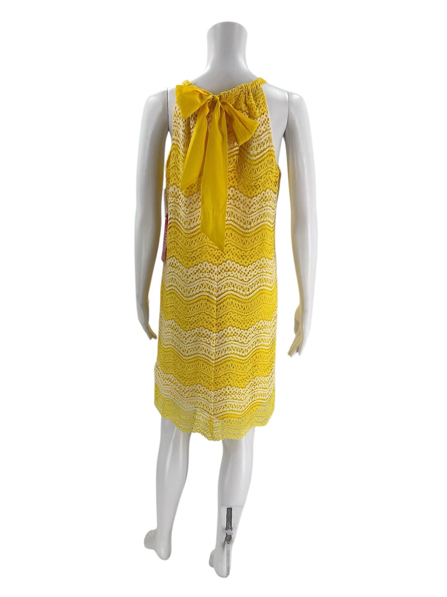 Back view of Trina Turk Knee Length Dress Size Small featuring yellow bow tie detail, lace fabric, available at Margaret’s Fine Consignments.