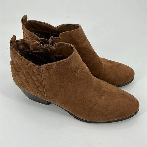 Style & Co Camel Quilted Bootie Size 7.5 with side zippers and low heels, available at Margaret’s Fine Consignment. Features quilted back detail.