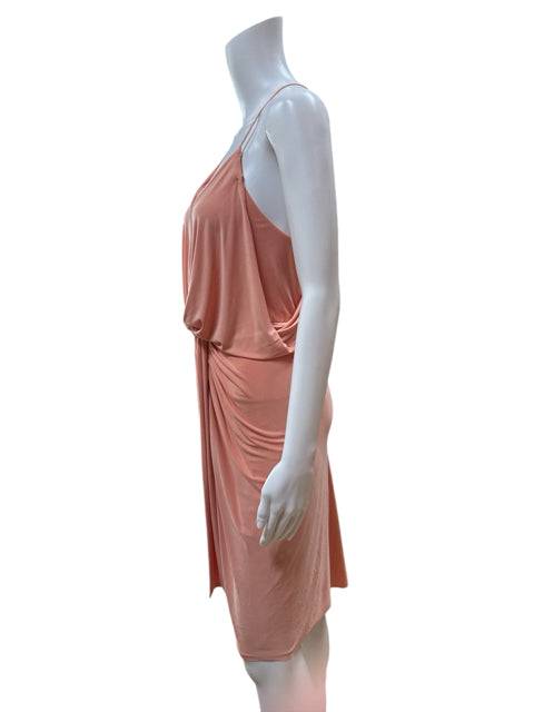 Side view of MISA Mini Dress Size Medium in peach, showcasing the draped silhouette and sleeveless design at Margaret’s Fine Consignments.