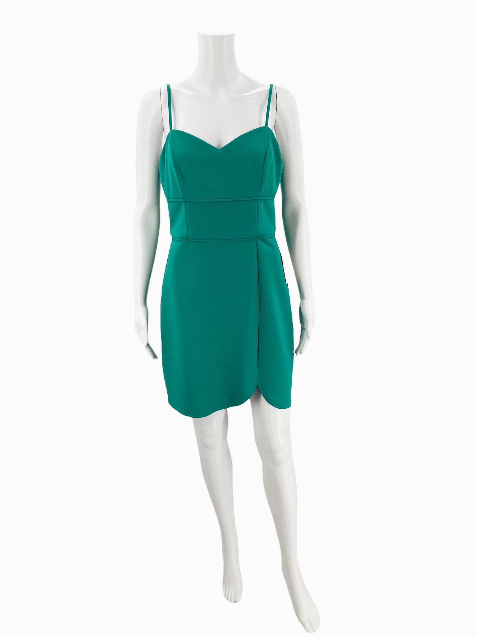 Front view of B Darlin green spaghetti strap mini dress size 11/12 on mannequin, sold by Margaret’s Fine Consignments for sustainable fashion shopping.