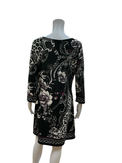 Back view of White House Black Market faux wrap dress featuring floral and paisley border print, 3/4 sleeves, and knee-length cut, size M.