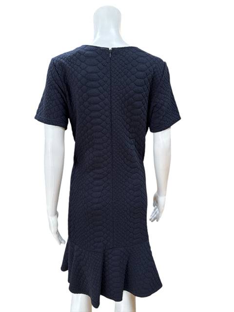 Back view of Sharagano Crew Neck Dress Size 10 on mannequin, featuring zipper closure and textured navy fabric at Margaret’s Fine Consignments.