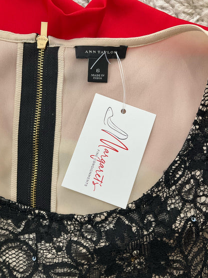 Ann Taylor sleeveless black lace top with colorblock design and embellishments, size 6, displayed on a neutral background.