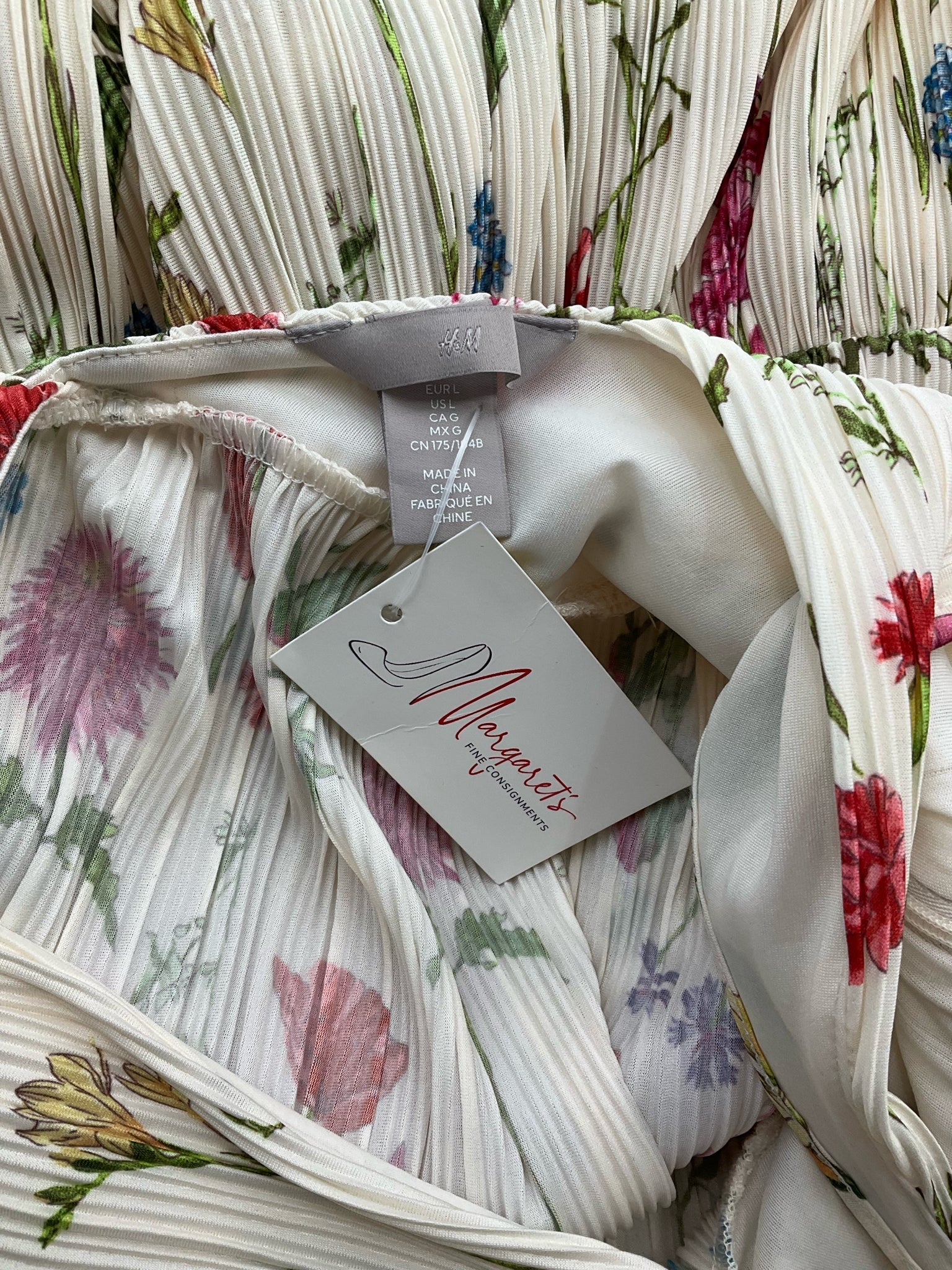 H&amp;M cream and multi floral maxi dress with pleated tiered skirt, halter neck, and open back, size large.