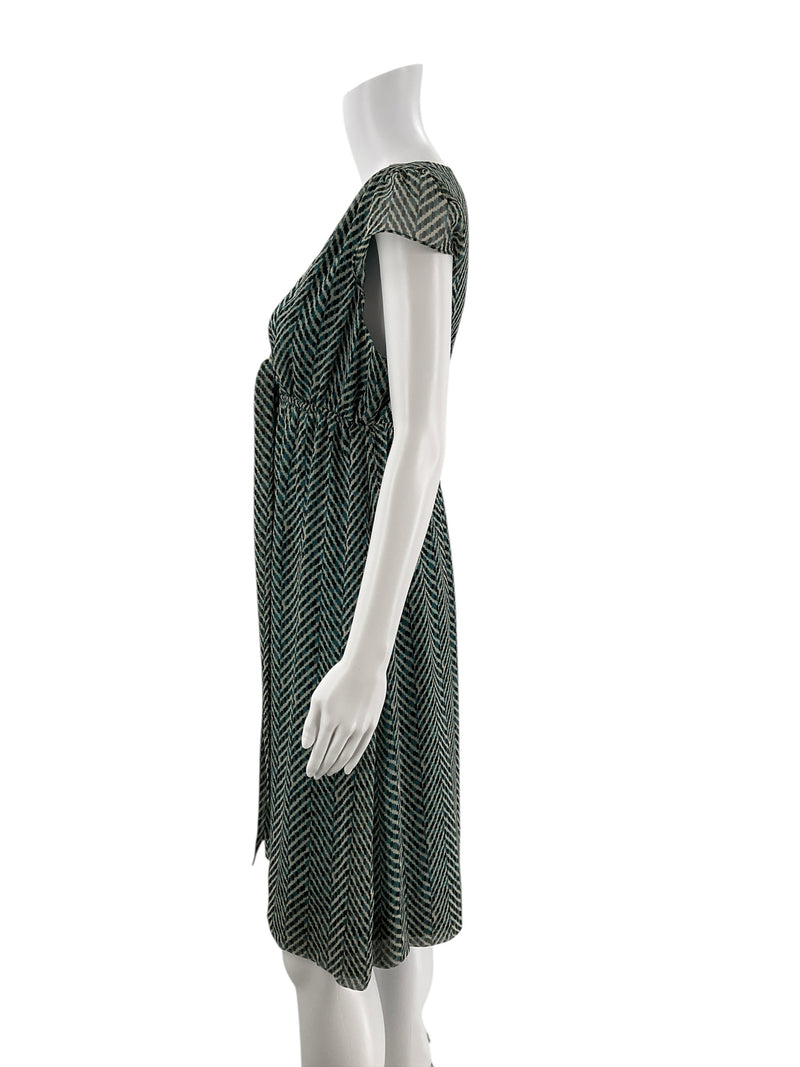 Side profile of New York & Co pre-owned teal/cream chiffon dress, highlighting cap sleeves and flattering fit and flare silhouette.