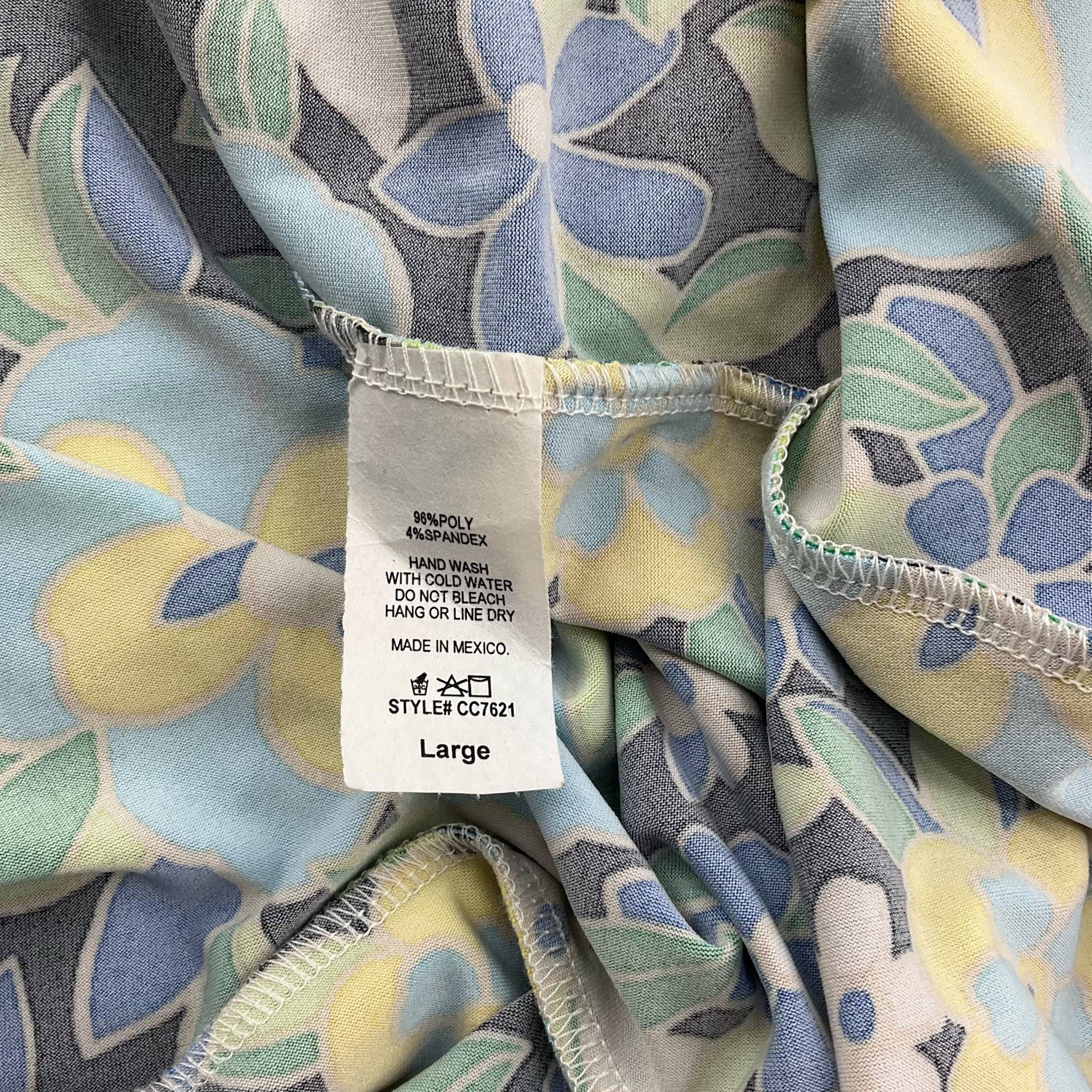 Fabric care label of Carole Christian Dress Size Large, black and multi floral mini dress, highlighting material and washing instructions.