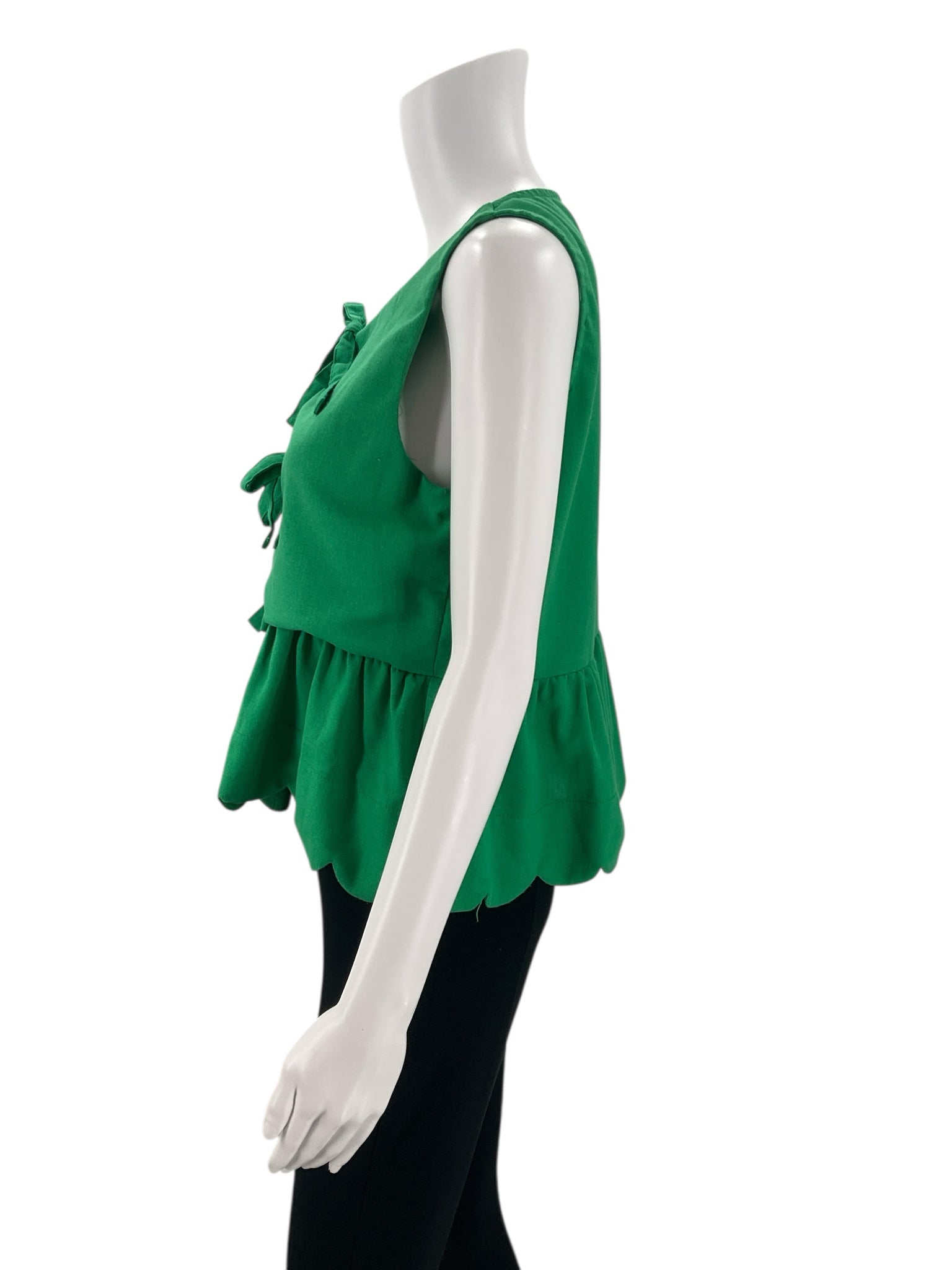 Side profile of Entro Green Solid Top - Size Medium highlighting sleeveless cut and peplum-style waist for a flattering fit.