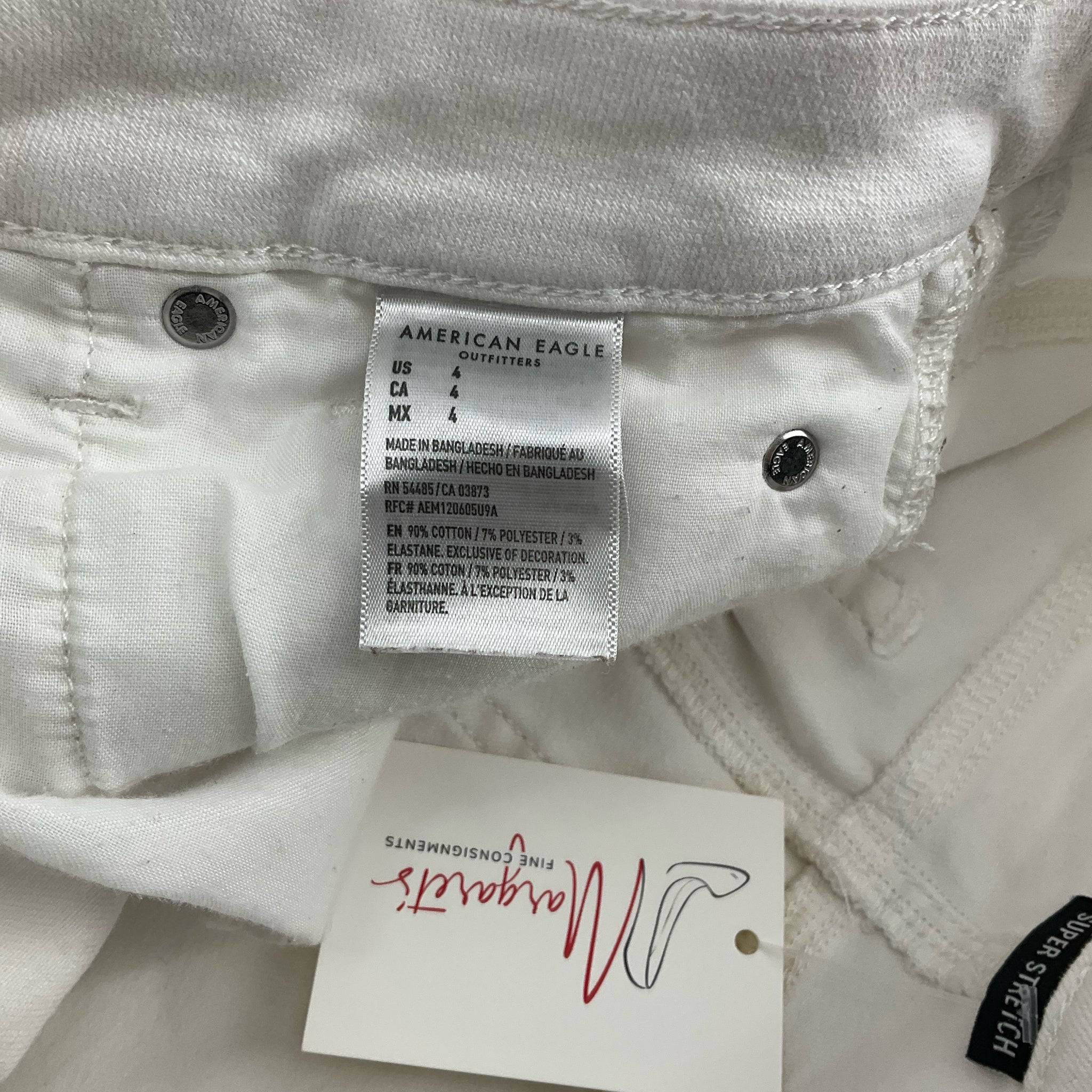 Size and care label showing american eagle Size 4 White ripped Shorts made in Bangladesh with cotton blend fabric.