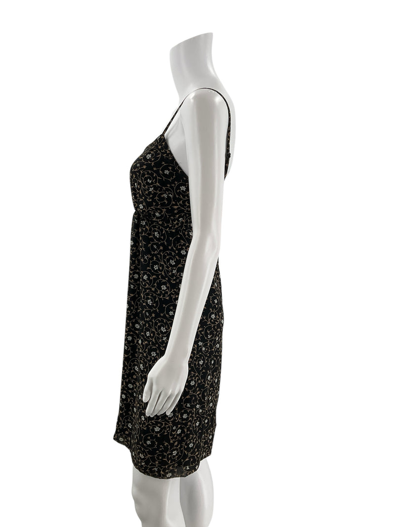 Side profile of Express black and taupe floral bias cut slip dress, showcasing midi length and sleeveless Y2K cocktail style.