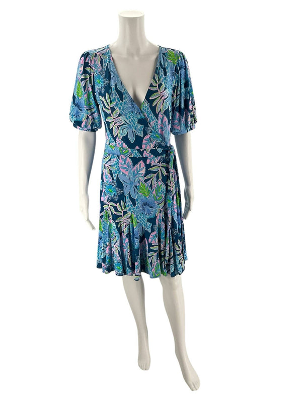 Front view of Lilly Pulitzer Blue & Multi-Color Floral Dress – Size S on mannequin, showcasing wrap-style V-neck and vibrant floral print.
