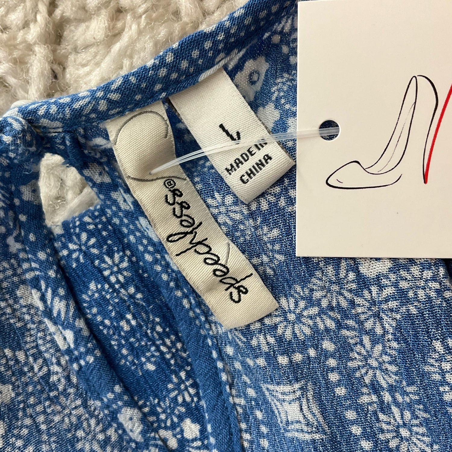 Speechless blue and white print ladies dress, size large, featuring a flowing design and elegant neckline.