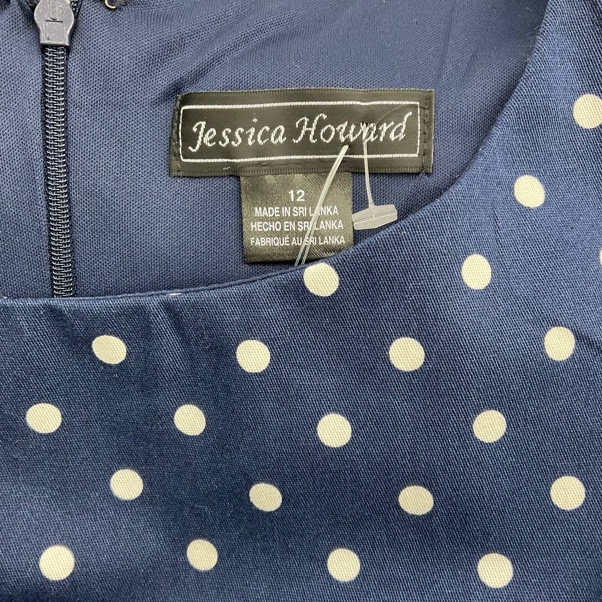 Close-up of Jessica Howard brand label on navy and white polka dot mini dress size 12, Margaret’s Fine Consignments.