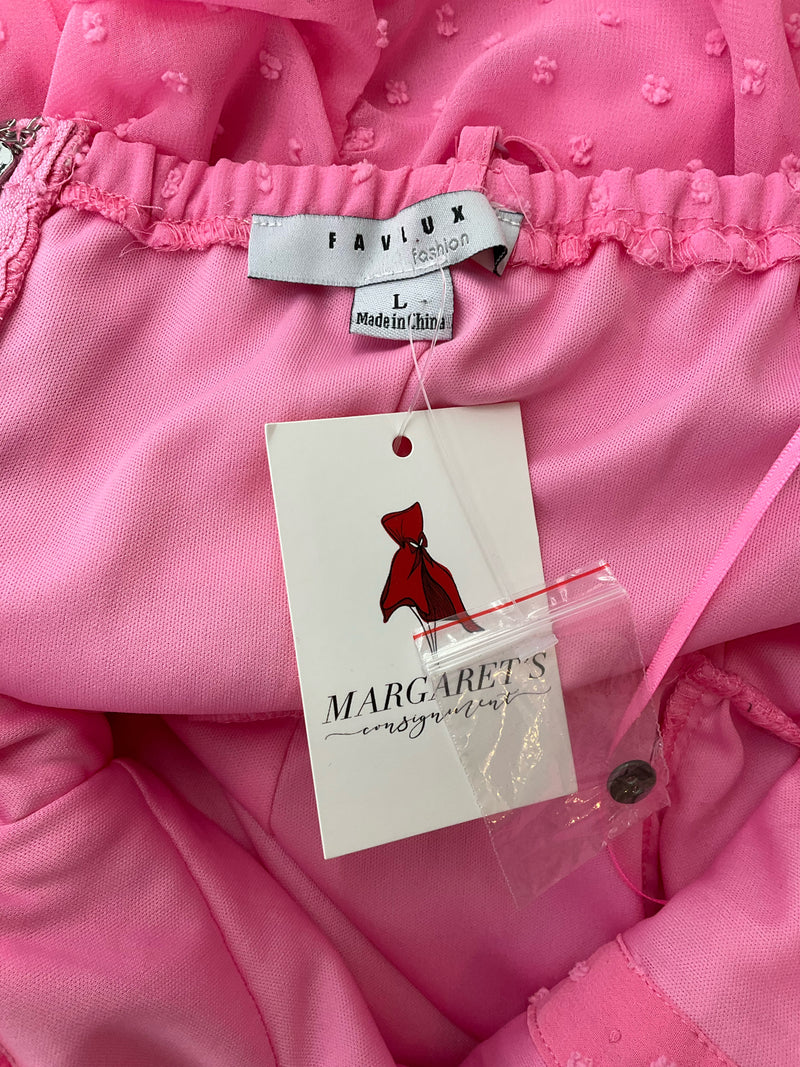 Close-up of Favlux dress label and Margaret’s Consignment tag confirming size Large and pre-owned status of the pink textured dress.