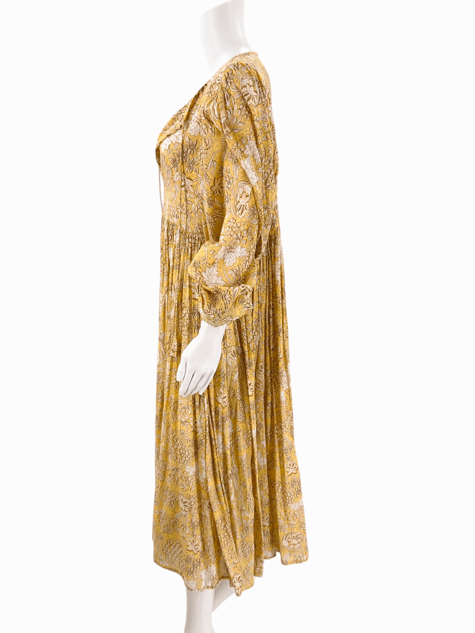 Side profile of Sundry Yellow/Tan Floral Dress - Size 4 highlighting its loose fit and lightweight cotton fabric for breezy summer comfort.