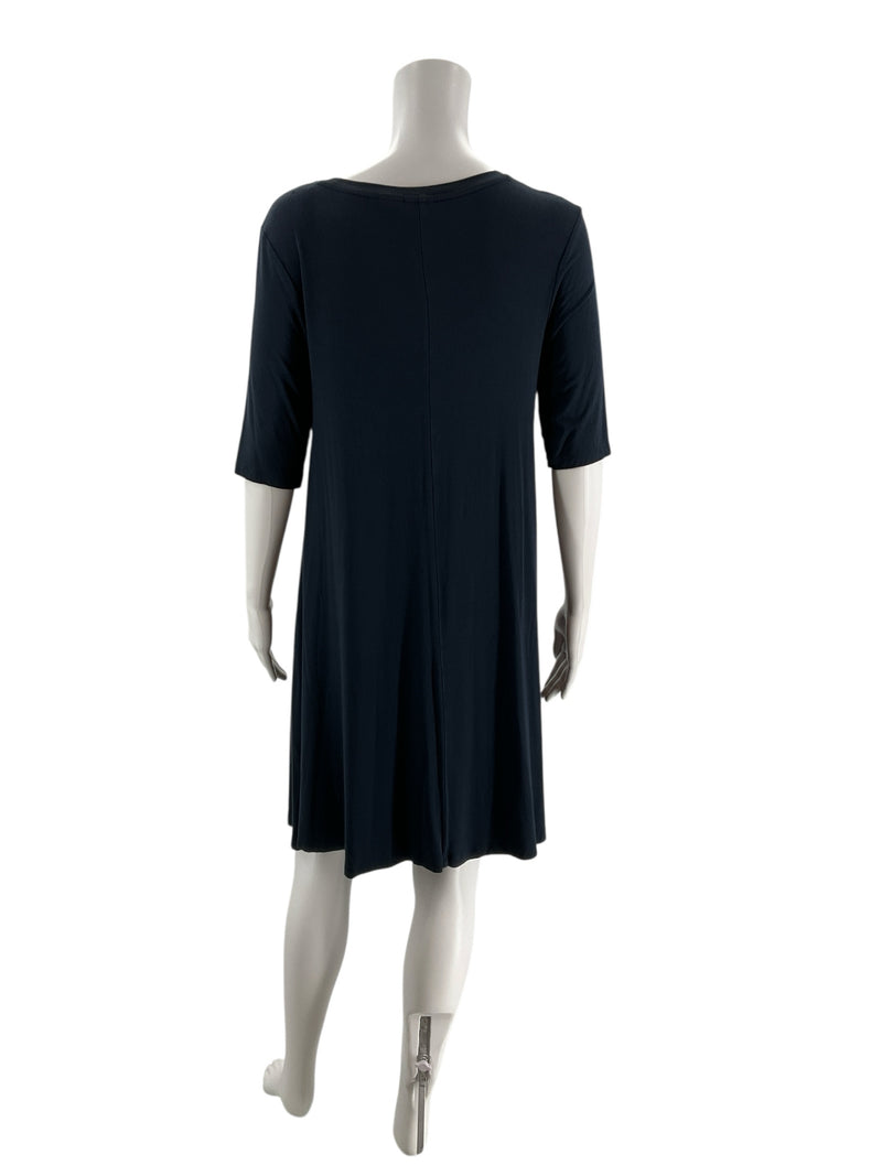 Back view of C&C California navy solid pre-owned dress in size medium, highlighting the flowy rayon-spandex jersey fabric.