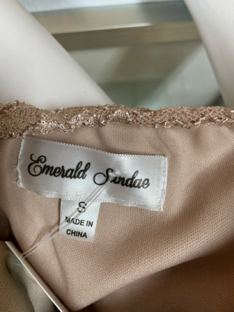 Brand label inside Emerald Sundae tan lace dress, size small, showing it is made in China.