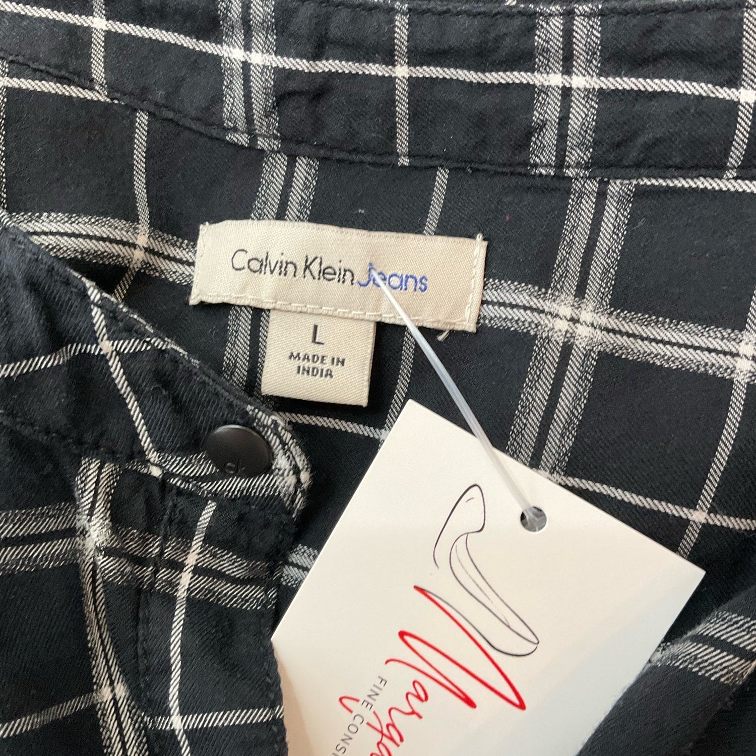 Calvin Klein black and white plaid casual top for women in size large, featuring a stylish and relaxed fit.