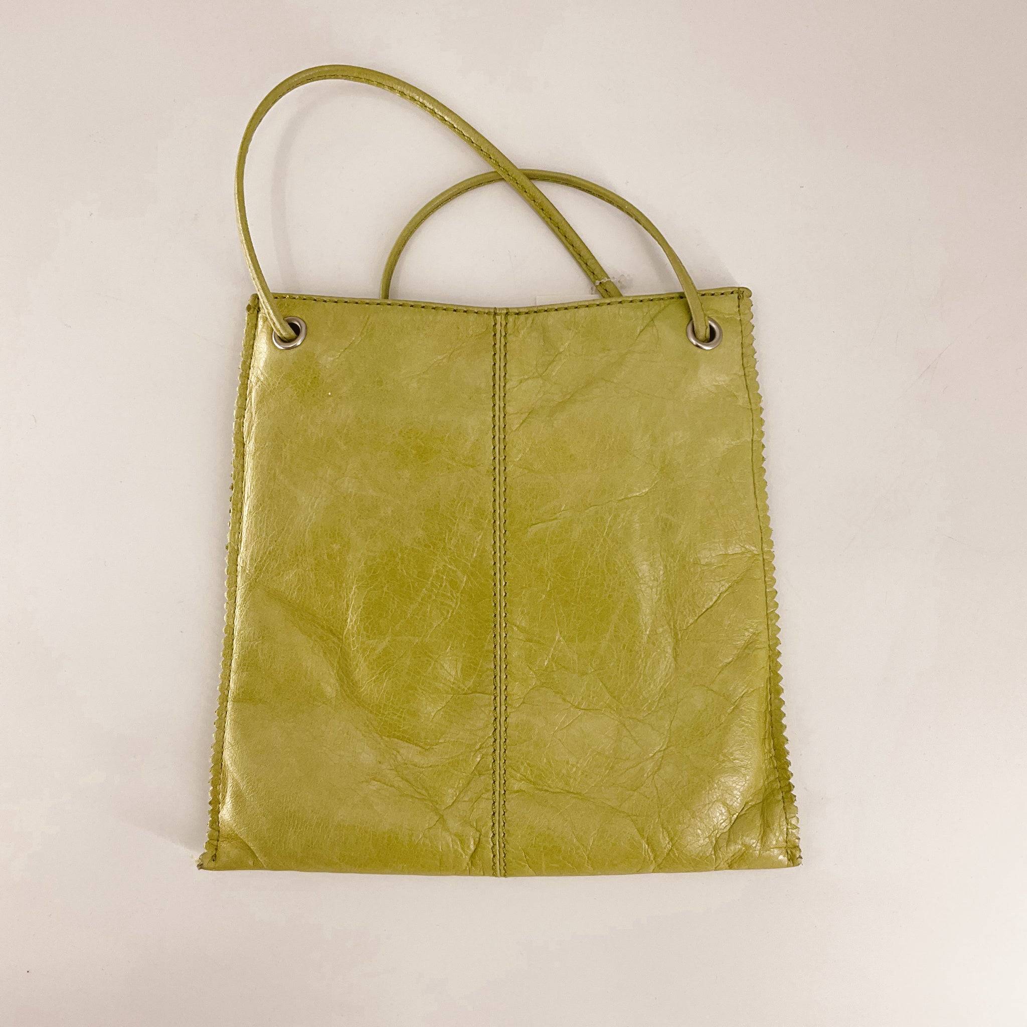 Hobo Green Solid Pre-Owned Crossbody Bag with dual top handles and visible stitching, available at Margaret's Fine Consignment. Stylish and gently used.