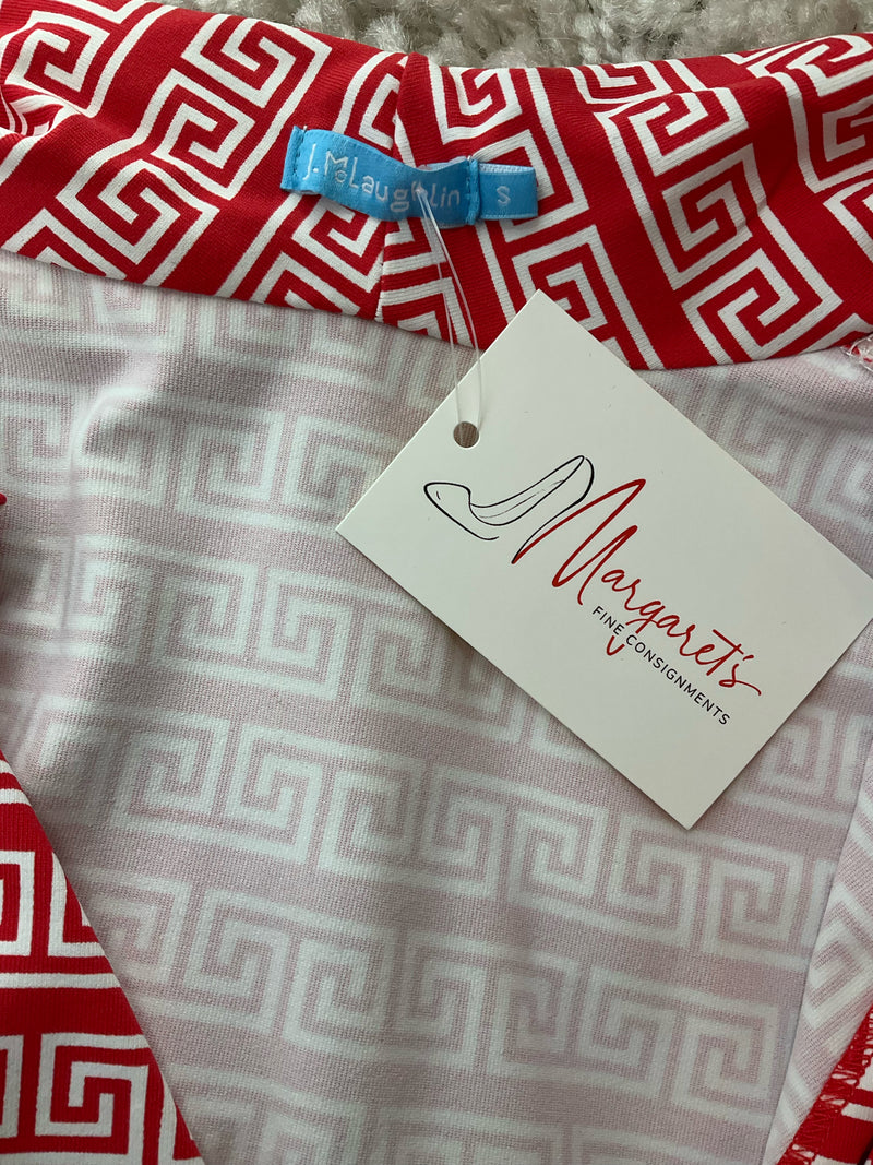 Close-up of J. McLaughlin label and consignment tag on coral Greek Key Catalina Cloth top. Pre-owned sleeveless blouse in size small.