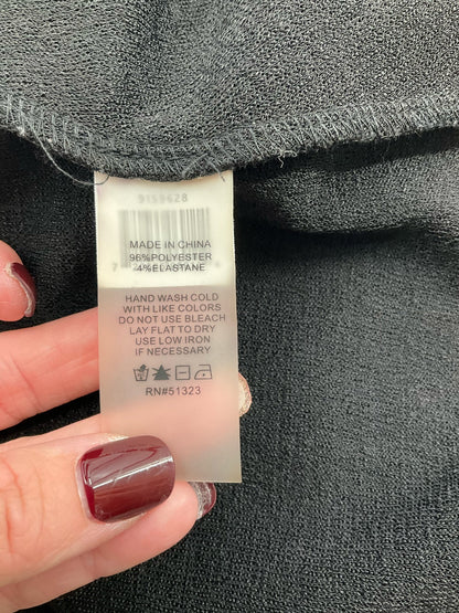 Vince Camuto black pre-owned ladies top, boat neck with twist front, asymmetrical design, drop shoulder, size small.