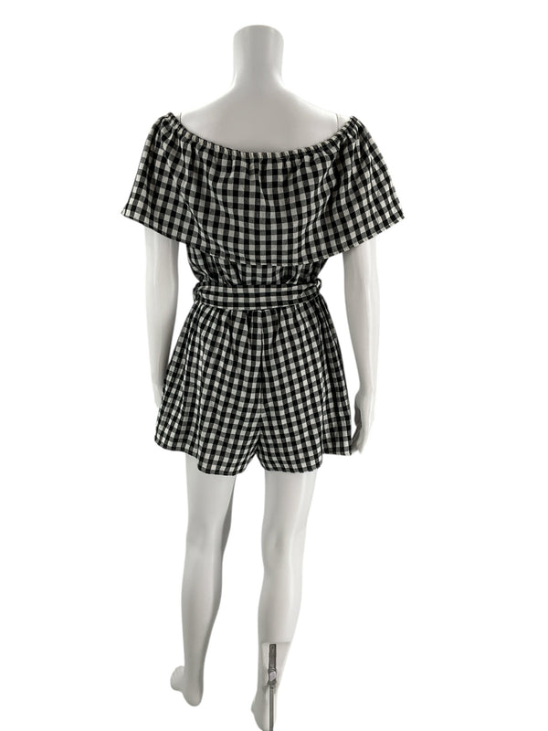 Back view of HYFVE black/white checkered romper, size large, showing elastic neckline and flared shorts for a flattering fit.