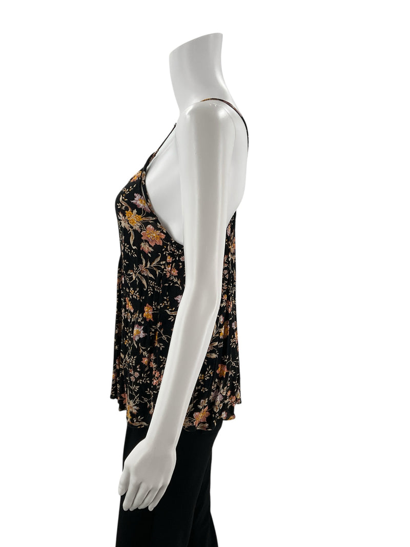 Side profile of American Eagle black/mustard floral babydoll tank top, highlighting its lightweight viscose fabric and flared hem.