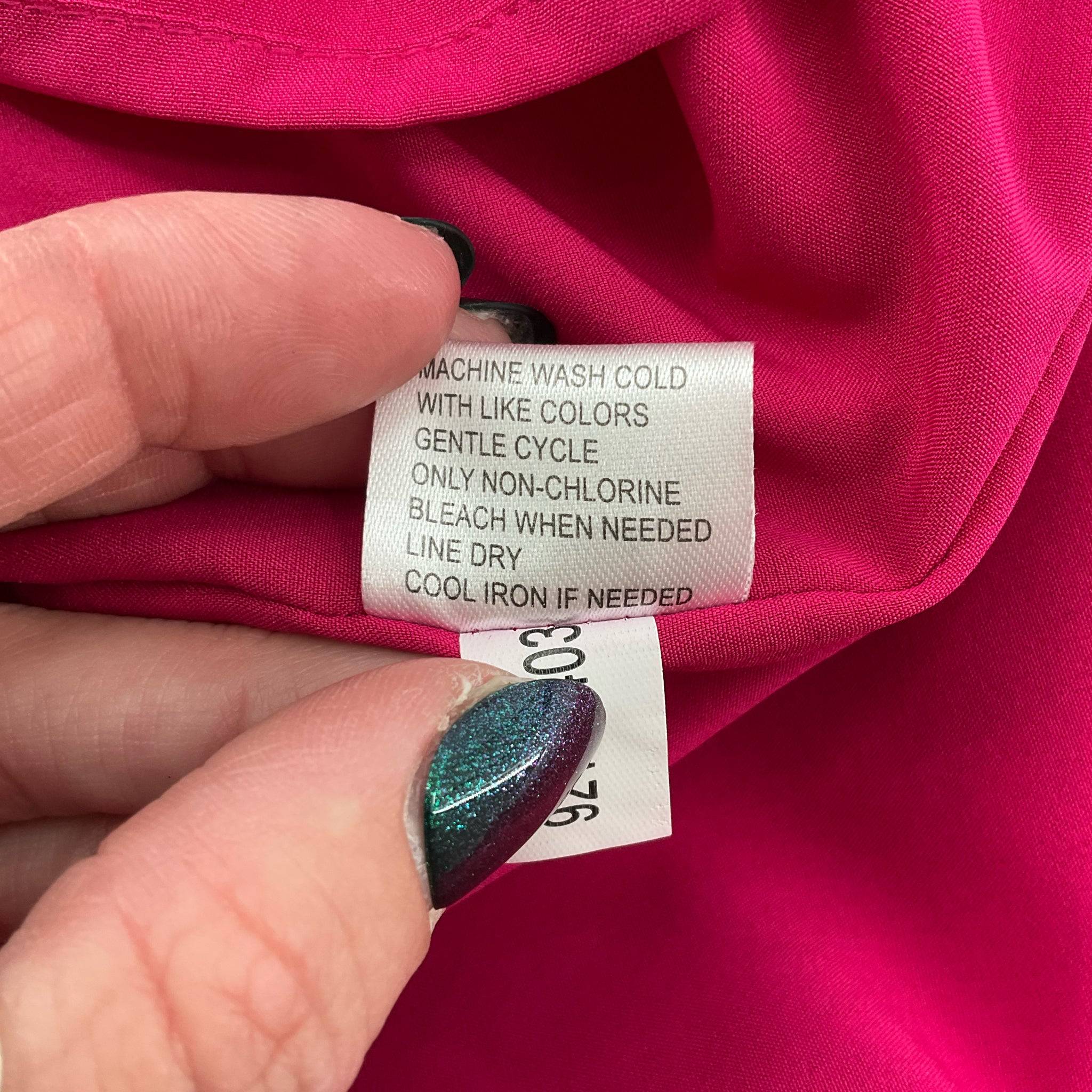 Care instructions tag for Alex Marie solid pink knee-length dress size 12, recommending machine wash cold and gentle cycle.